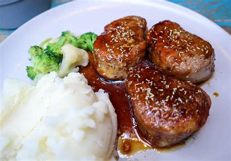 How does Grilled Pork Medallions with Balsamic Glazed Pears fit into your Daily Goals - calories, carbs, nutrition