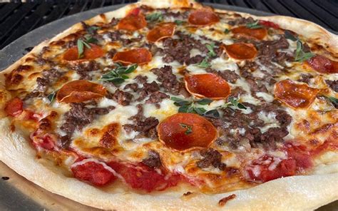 How does Ground Beef Pizza, Topped fit into your Daily Goals - calories, carbs, nutrition