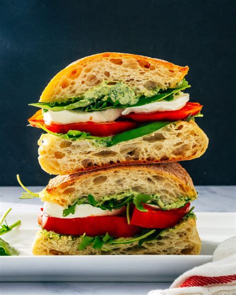 How does Half Caprese Sandwich with Spinach Salad fit into your Daily Goals - calories, carbs, nutrition