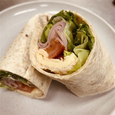 How does Ham American Cheese Wrap withPotato Salad fit into your Daily Goals - calories, carbs, nutrition