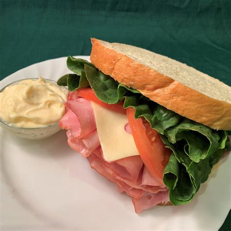 How does Ham Sandwich with Swiss Cheese fit into your Daily Goals - calories, carbs, nutrition