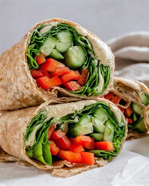 How does Hummus- Vegetable and Cheddar Wrap fit into your Daily Goals - calories, carbs, nutrition