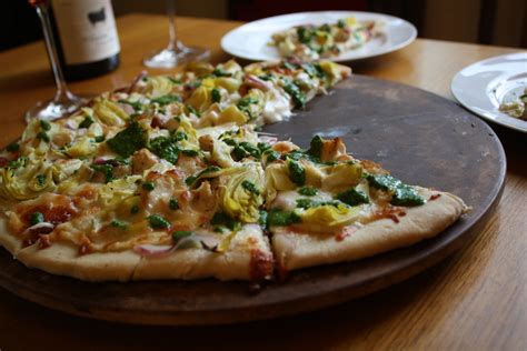 How does Individual 7 - Chicken Artichoke Pizza fit into your Daily Goals - calories, carbs, nutrition