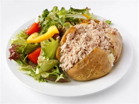 How does Jacket Potato with Chicken Mayonnaise fit into your Daily Goals - calories, carbs, nutrition