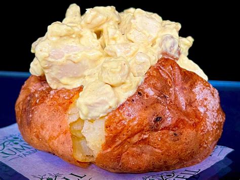 How does Jacket Potato with Coronation Chicken fit into your Daily Goals - calories, carbs, nutrition