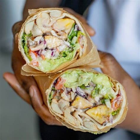 How does Jerk Chicken Wrap (32040.5) fit into your Daily Goals - calories, carbs, nutrition