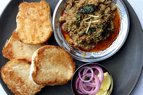 How does Kheema Pur Eedu (Spiced Minced Lamb & Fried Egg) fit into your Daily Goals - calories, carbs, nutrition