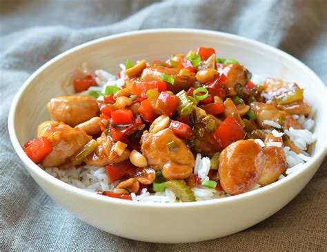 How does Kung Pao Chicken over Coconut-Peanut Rice and Gingered Snow Peas fit into your Daily Goals - calories, carbs, nutrition