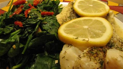 How does Lemon Dill Cod with Mustard Sauce and Garlic Wilted Spinach fit into your Daily Goals - calories, carbs, nutrition