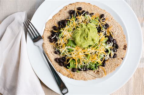 How does Mango Black Bean Tostada fit into your Daily Goals - calories, carbs, nutrition