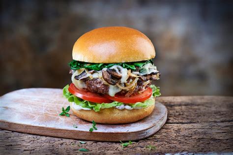 How does Mushroom Swiss Cheese Burger WW Bun (32409.12) fit into your Daily Goals - calories, carbs, nutrition