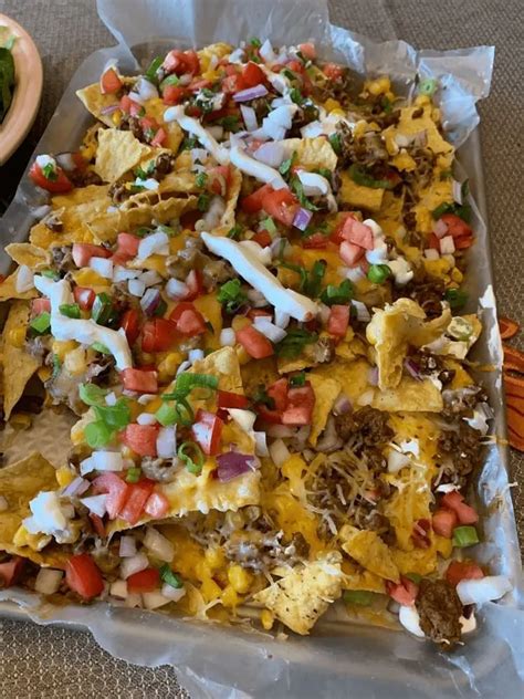 How does Nachos Supreme with Beef fit into your Daily Goals - calories, carbs, nutrition