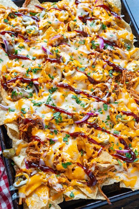 How does Nachos with Cheese Sauce and Pulled Pork fit into your Daily Goals - calories, carbs, nutrition