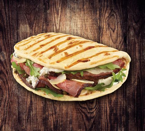 How does Panini Flatbread Roast Beef Ricotta fit into your Daily Goals - calories, carbs, nutrition