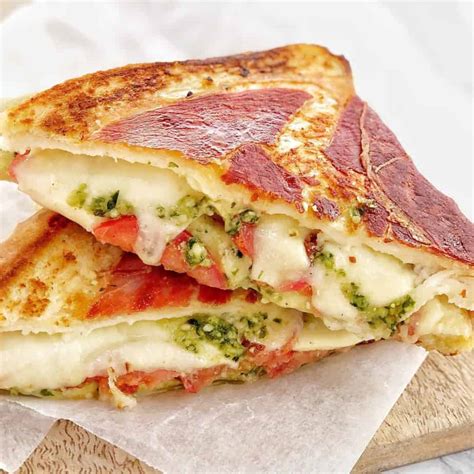 How does Panini Grilled Cheese Prosciutto & Pesto Sunflower Multigrain fit into your Daily Goals - calories, carbs, nutrition