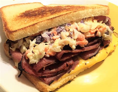 How does Pastrami with Cole Slaw & Swiss fit into your Daily Goals - calories, carbs, nutrition