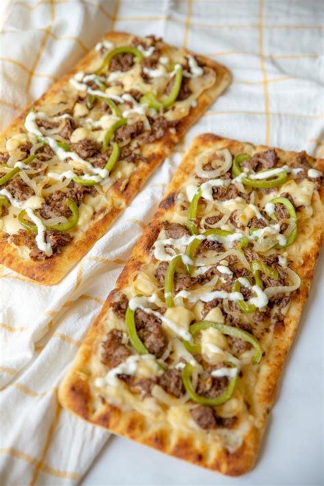 How does Philly Cheesesteak Flatbread Pizza fit into your Daily Goals - calories, carbs, nutrition