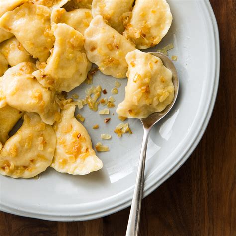 How does Pierogies, Potato and Cheddar Cheese fit into your Daily Goals - calories, carbs, nutrition