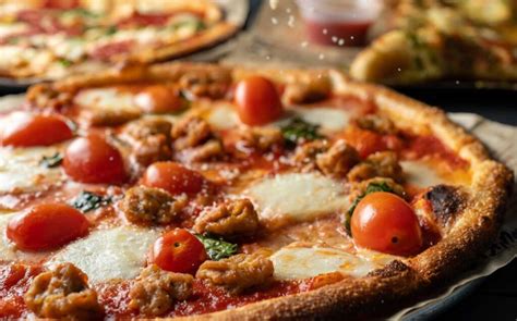 How does Pizza, Italian Sausage (Bostwick) fit into your Daily Goals - calories, carbs, nutrition