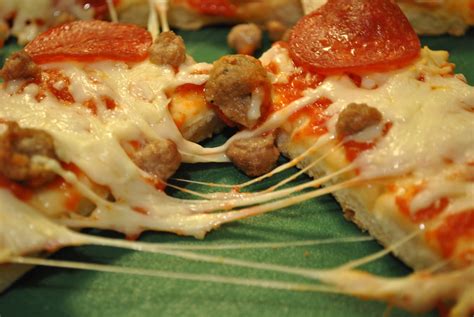 How does Pizza Dipping Strips Three Meat Pizza fit into your Daily Goals - calories, carbs, nutrition