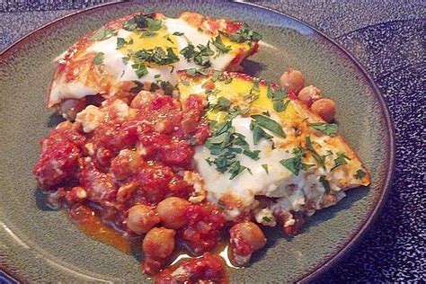 How does Poached Eggs in Tomato with Chickpea and Feta fit into your Daily Goals - calories, carbs, nutrition