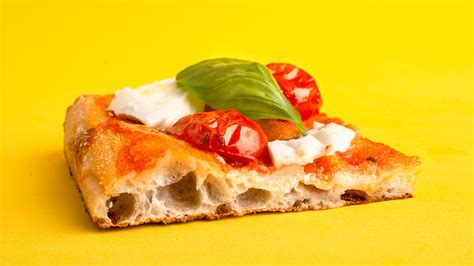 How does Quattro Formaggio Roman Style Pizza - by the ounce fit into your Daily Goals - calories, carbs, nutrition