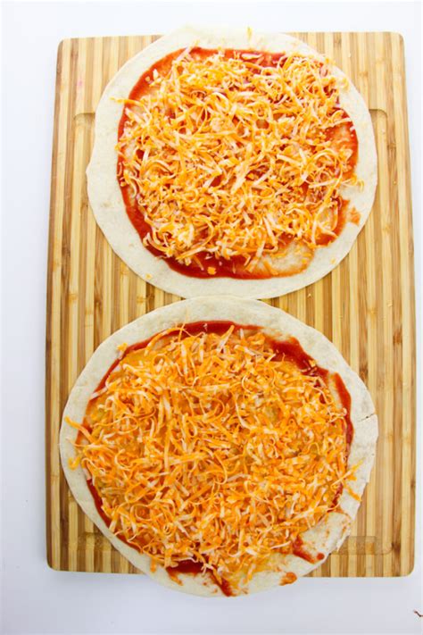 How does Quesadilla Individual Pizza (111135.15) fit into your Daily Goals - calories, carbs, nutrition