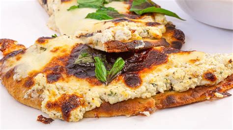 How does Roasted Garlic White Flatbread Pizza - cut 4 fit into your Daily Goals - calories, carbs, nutrition