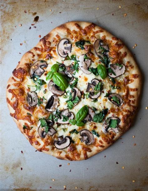 How does Roasted Mushroom with Spinach Wheat Pizza fit into your Daily Goals - calories, carbs, nutrition