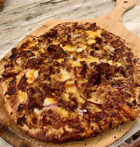 How does Rustic Carolina BBQ Pizza fit into your Daily Goals - calories, carbs, nutrition