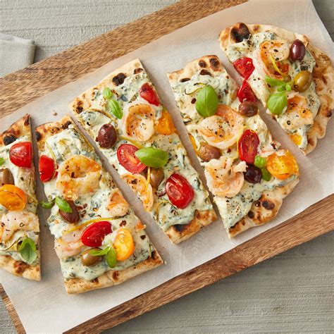 How does Rustic Spinach, Artichoke and Cajun Shrimp Flatbread fit into your Daily Goals - calories, carbs, nutrition