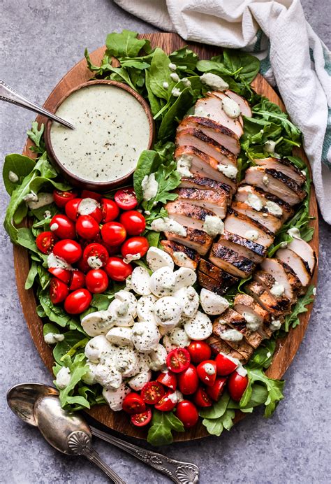 How does Salad Entree Chicken Grilled Caprese Style Naan & White Bean Spread fit into your Daily Goals - calories, carbs, nutrition