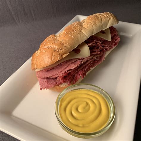 How does Sandwich Hot Corned Beef Mustard fit into your Daily Goals - calories, carbs, nutrition