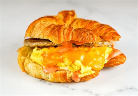 How does Sausage, Egg and Cheddar Croissant Sandwich fit into your Daily Goals - calories, carbs, nutrition