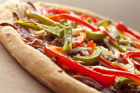 How does Sausage Pepper and Onion Pizza fit into your Daily Goals - calories, carbs, nutrition