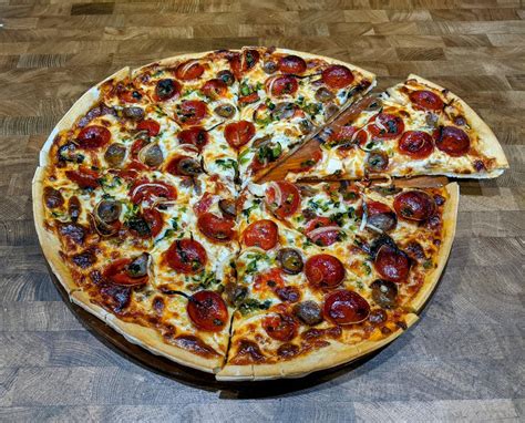 How does Sausage and Poblano Pizza Hand Stretched (73694.0) fit into your Daily Goals - calories, carbs, nutrition