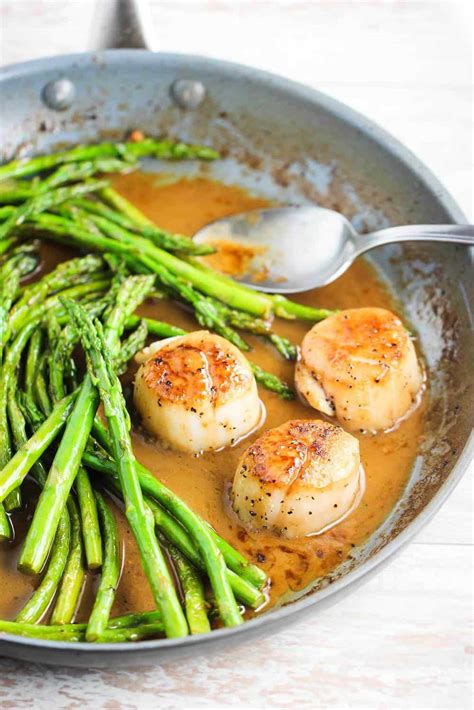 How does Scallops and Asparagus in Wine Sauce fit into your Daily Goals - calories, carbs, nutrition