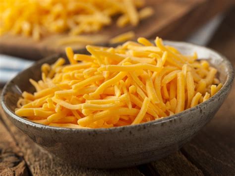 How does Shredded Mild Cheddar Cheese fit into your Daily Goals - calories, carbs, nutrition