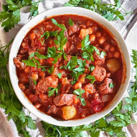 How does Slowly Cooked Lamb Tagine with Parsley & Mint Cous Cous fit into your Daily Goals - calories, carbs, nutrition