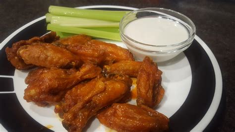 How does Spicy Buffalo Wings with Blue Cheese and Celery Sticks fit into your Daily Goals - calories, carbs, nutrition