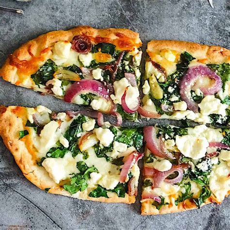 How does Spinach Feta Pizza Wheat Crust fit into your Daily Goals - calories, carbs, nutrition