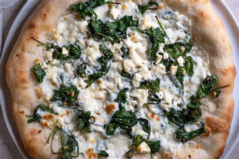 How does Spinach and Feta Pizza fit into your Daily Goals - calories, carbs, nutrition