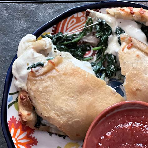 How does Spinach and Mushroom Calzone fit into your Daily Goals - calories, carbs, nutrition