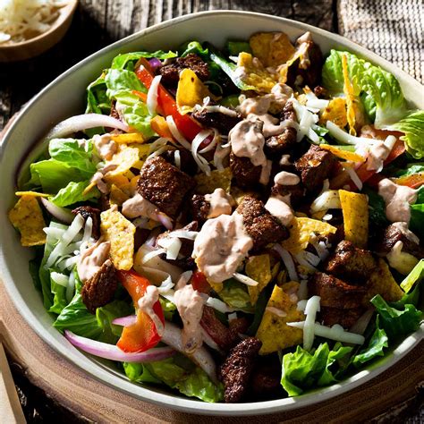 How does Steak Fajita Fiesta Taco Salad fit into your Daily Goals - calories, carbs, nutrition