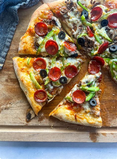 How does Supreme Pizza fit into your Daily Goals - calories, carbs, nutrition