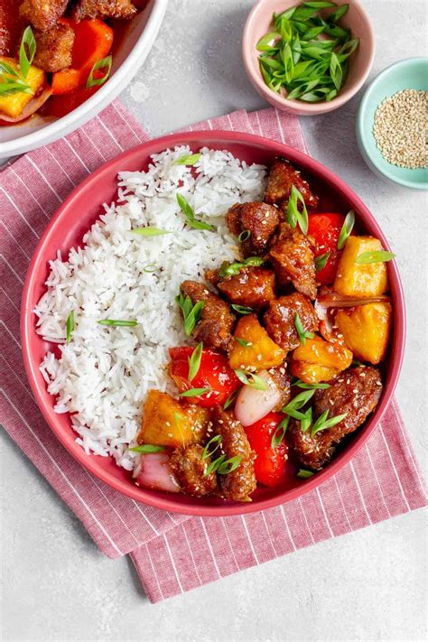 How does Sweet Sour Pork over Steamed Rice fit into your Daily Goals - calories, carbs, nutrition