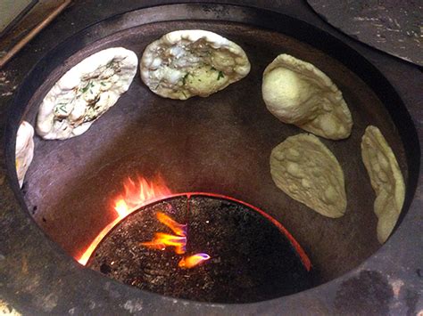 How does Tandoor Baked Naan fit into your Daily Goals - calories, carbs, nutrition