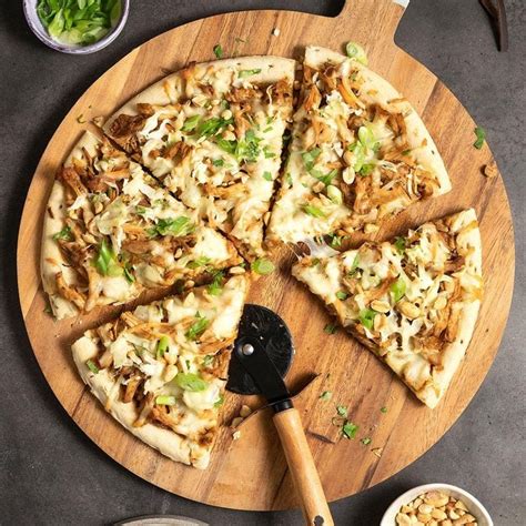 How does Thai Chicken Pizza, Topped, Personal Size fit into your Daily Goals - calories, carbs, nutrition