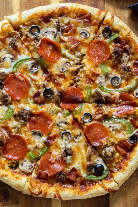 How does Thin Crust Supreme Pizza fit into your Daily Goals - calories, carbs, nutrition