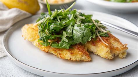 How does Tilapia 5-7 oz Milanese Arugula & Grape Tomato Salad fit into your Daily Goals - calories, carbs, nutrition